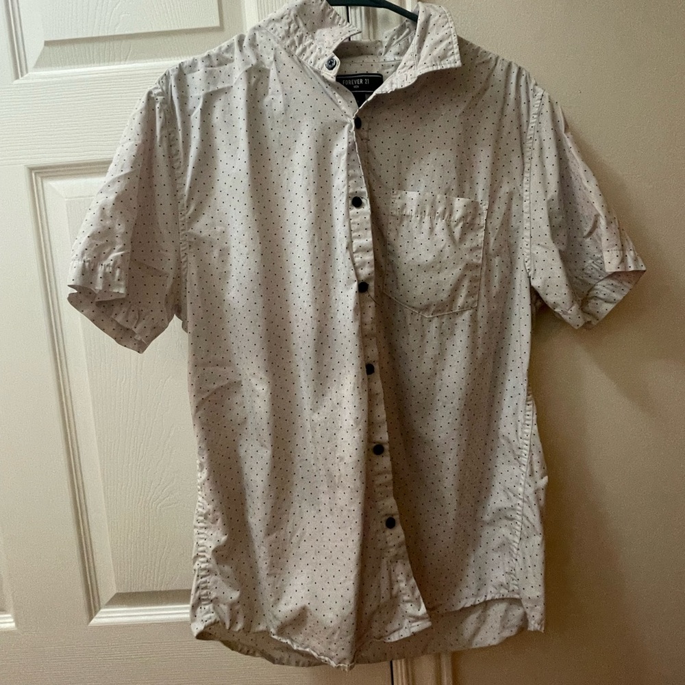 This is a forever 21 white and black pock-a-dot button up shirt